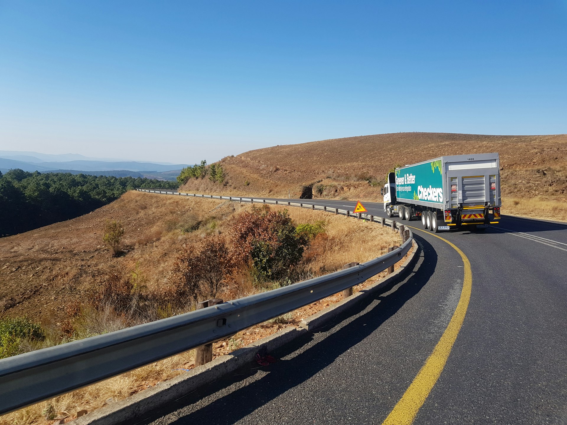 white and blue truck on road during daytime